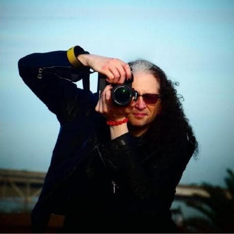 Eric Elliott holding a camera